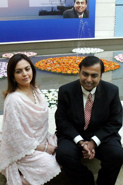 Mukesh Ambani (R), chairman of Reliance Industries, poses with wife Nita